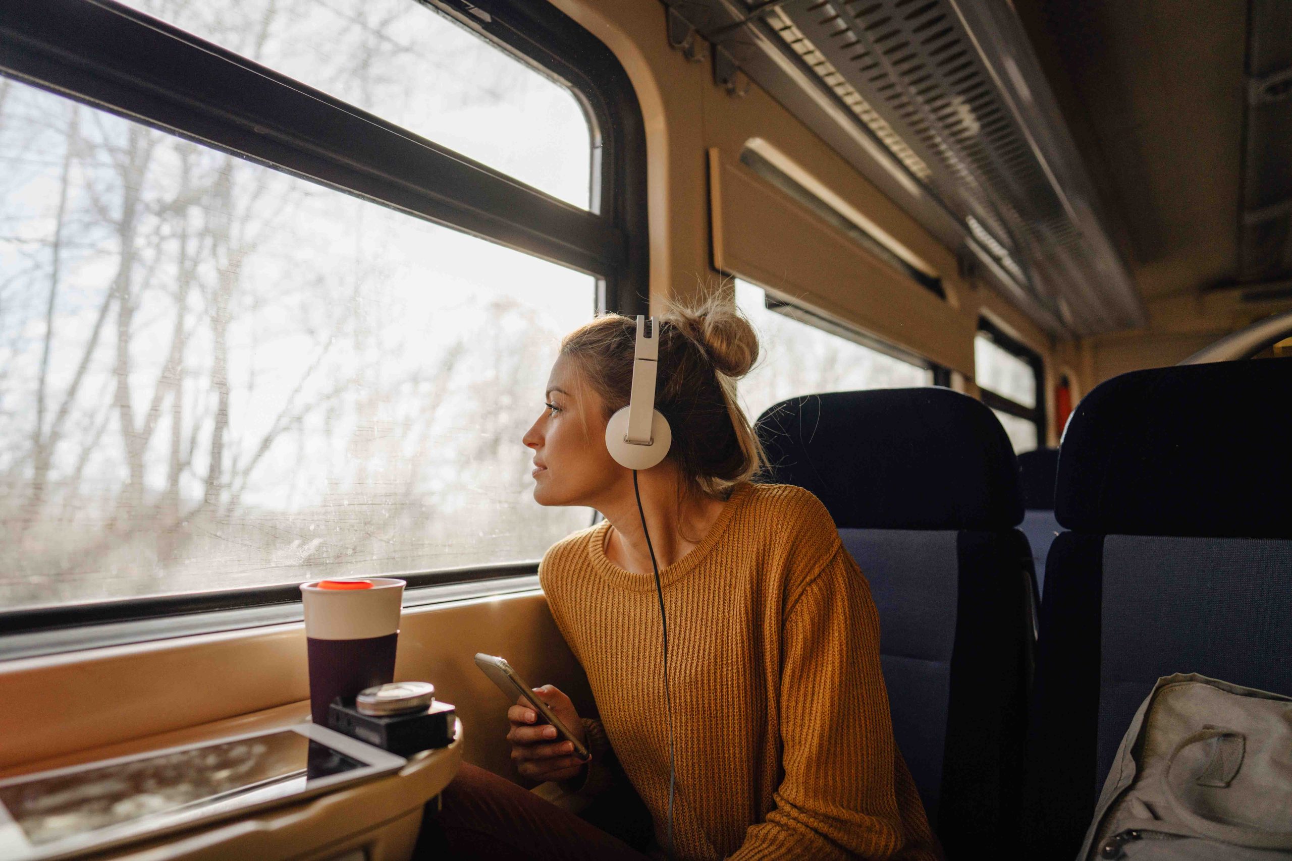 Woman listening to music on a train